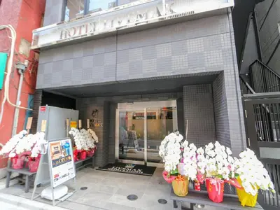 a store with vases of flowers in front of it at HOTEL LiVEMAX Nihonbashi Ningyocho in Tokyo