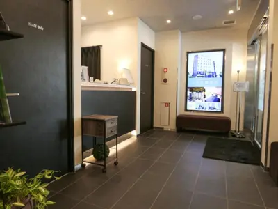 a hallway with a television in a building at HOTEL LiVEMAX Tokyo Kanda-Ekimae in Tokyo