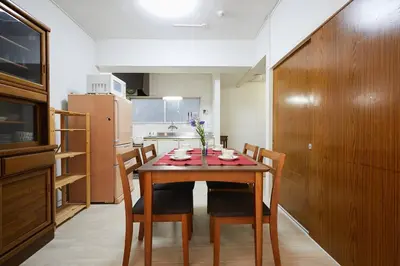 a dining room with a table and chairs in a kitchen at G&R House 102 in Tokyo
