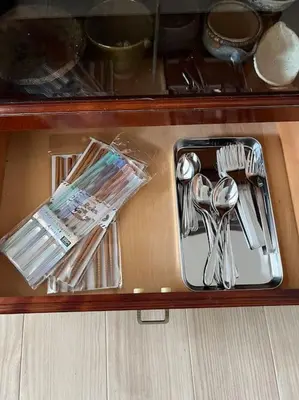 a tray with silver utensils on a table at G&R House302 in Tokyo