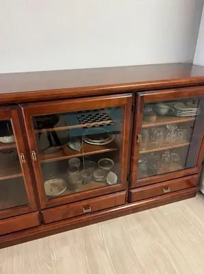 a wooden cabinet with glass doors with dishes in it at G&R House302 in Tokyo