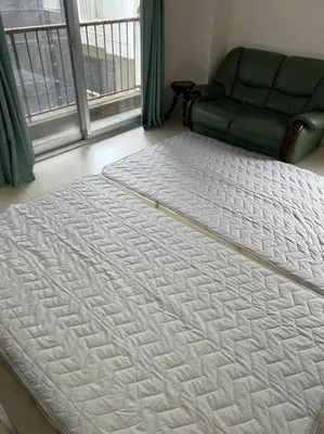 a large white bed in a room with a couch at G&R House302 in Tokyo