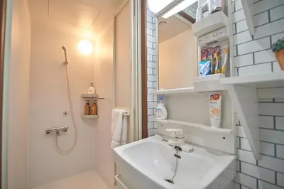 a bathroom with a sink and a shower at 3 min to Komagome Sta by foot, 15-minute to Shinju, Tokyo station by JR in Tokyo