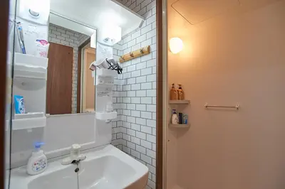 a bathroom with a sink and a mirror at 3 min to Komagome Sta by foot, 15-minute to Shinju, Tokyo station by JR in Tokyo