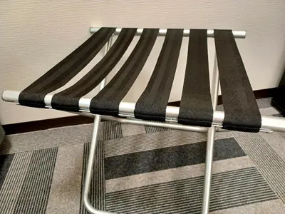 a black and white bench in a room at Akasaka Urban Hotel Annex in Tokyo