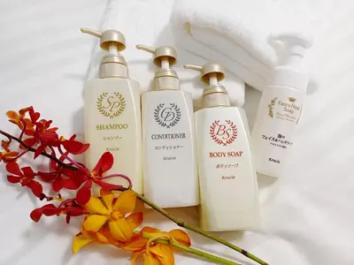 a group of three bottles of soap and flowers at Akasaka Urban Hotel Annex in Tokyo