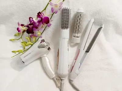a group of hair brushes and a bouquet of flowers at Akasaka Urban Hotel Annex in Tokyo