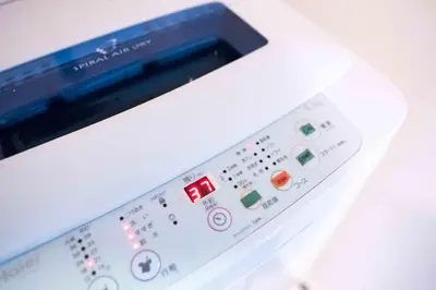 a close up of a nintendo wii remote control at MINIMAL SHIMOKITA Stylish Loft or Studio Apt in Tokyo