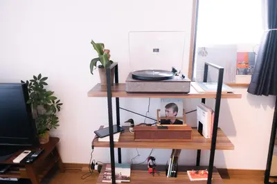 a shelf with a desk with a child on it at MINIMAL SHIMOKITA Stylish Loft or Studio Apt in Tokyo
