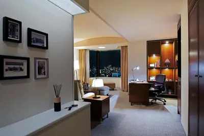 a hotel room with a desk and a room at Imperial Hotel Tokyo in Tokyo