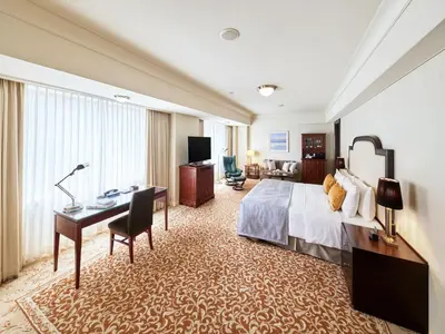 a hotel room with a bed and a desk at Imperial Hotel Tokyo in Tokyo