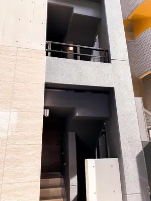 a building with a staircase leading to a hallway at NEST HATAGAYA Stylish Apt in Tokyo