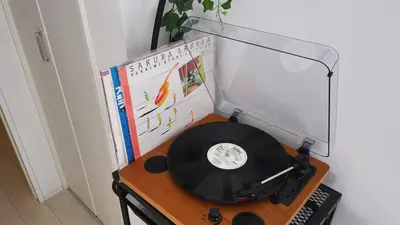 a desk with a record player and a lamp at NEST HATAGAYA Stylish Apt in Tokyo