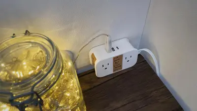 a plugged in electrical outlet on a wall at NEST HATAGAYA Stylish Apt in Tokyo