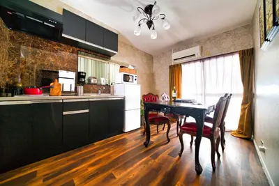 a kitchen with a table and chairs in a room at K&K Jujo House in Tokyo
