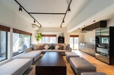 a living room with a couch and a table at NIYS apartments 07 type in Tokyo