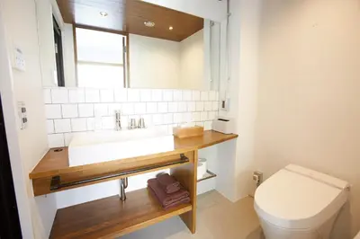 a bathroom with a sink and a toilet at No Service Hotel in Tokyo