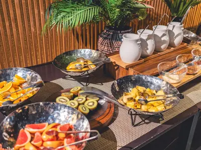 a table with four bowls of fruit on it at Roppongi Hotel S in Tokyo