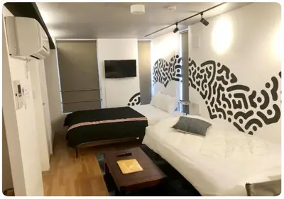 a small room with two beds and a table at world potential / Vacation STAY 4630 in Tokyo