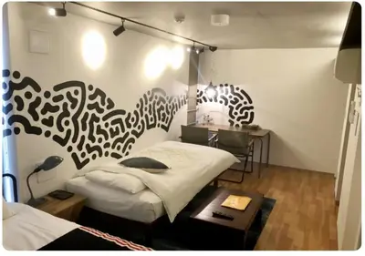 a room with a bed and a desk in it at world potential / Vacation STAY 4630 in Tokyo