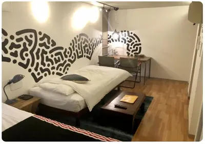 a bedroom with a bed and a table and a desk at world potential / Vacation STAY 4630 in Tokyo