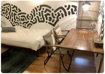a room with a table and a bed and a desk at world potential / Vacation STAY 4630 in Tokyo