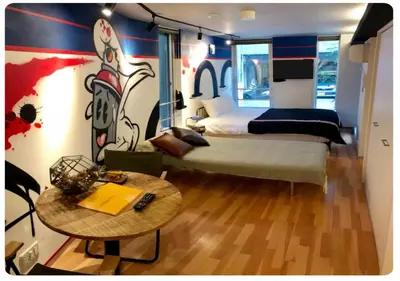 a bedroom with a bed and a table with a table sidx sidx sidx at world potential / Vacation STAY 4610 in Tokyo