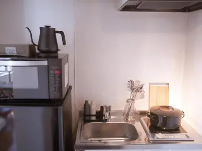 a kitchen counter with a sink and a microwave at world potential / Vacation STAY 4610 in Tokyo