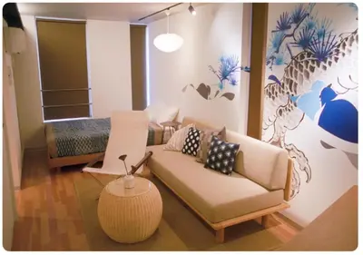 a living room with a couch and a bed at world potential / Vacation STAY 4611 in Tokyo