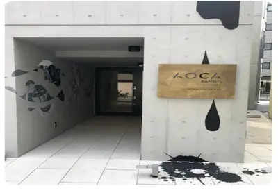 a building with a sign on the side of it at world potential / Vacation STAY 4611 in Tokyo