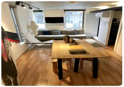 a living room with a table and a couch at world potential / Vacation STAY 4613 in Tokyo