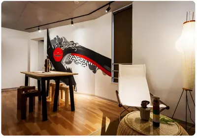 a dining room with a table and a painting on the wall at world potential / Vacation STAY 4613 in Tokyo