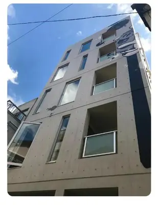 a tall building with windows on the side of it at world potential / Vacation STAY 4613 in Tokyo