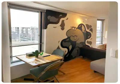 a room with a table and chairs and a window at world potential / Vacation STAY 4631 in Tokyo
