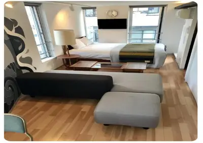 a hotel room with a bed and a couch at world potential / Vacation STAY 4631 in Tokyo