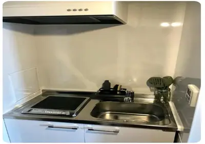 a kitchen counter with a sink and a stove at world potential / Vacation STAY 4631 in Tokyo