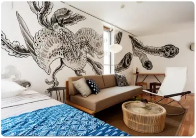 a bedroom with a couch and a dragon mural on the wall at world potential / Vacation STAY 4632 in Tokyo