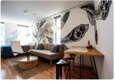 a living room with a couch and a table at world potential / Vacation STAY 4632 in Tokyo
