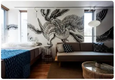 a bedroom with a couch and a wall with a mural at world potential / Vacation STAY 4632 in Tokyo