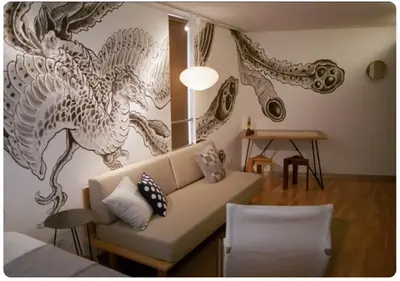 a living room with a couch and a dragon mural on the wall at world potential / Vacation STAY 4632 in Tokyo
