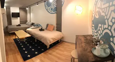 a small room with two beds and a table at world potential / Vacation STAY 4612 in Tokyo