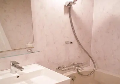 a bathroom with a shower with a sink and a mirror at world potential / Vacation STAY 4612 in Tokyo