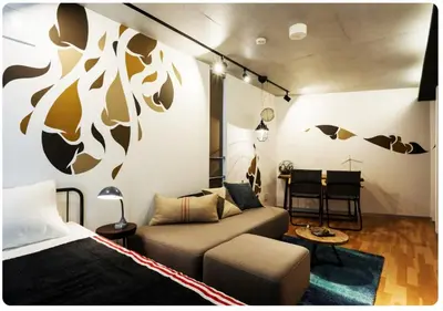 a living room with a couch and a bed at world potential / Vacation STAY 4628 in Tokyo