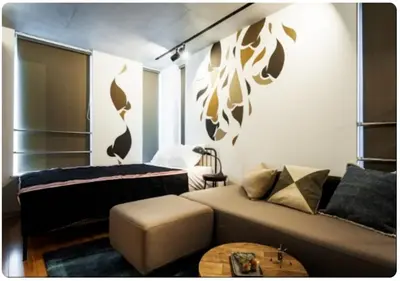 a living room with a couch and a bed at world potential / Vacation STAY 4628 in Tokyo
