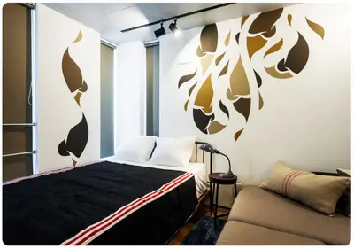 a bedroom with a bed and a couch at world potential / Vacation STAY 4628 in Tokyo