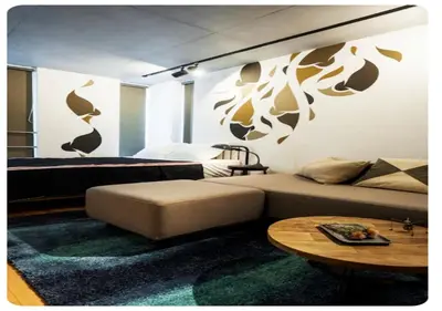 a bedroom with a bed and a couch and a table at world potential / Vacation STAY 4628 in Tokyo