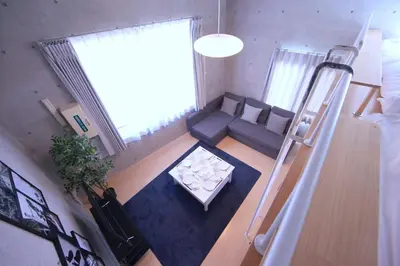 an overhead view of a living room with a couch and a table at Laffitte Tokyo in Tokyo