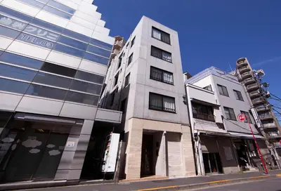 a tall building on a city street at Laffitte Tokyo in Tokyo