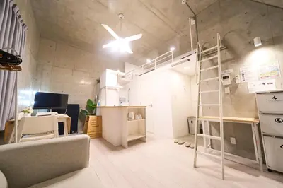 a large room with a loft bed and a desk at \u30e9\u30d5\u30a3\u30c3\u30c8\u5fa1\u5f92\u753a in Tokyo