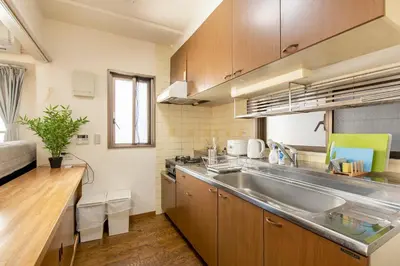 a kitchen with a sink and a counter top at Uhome Akihabara Apartment 3 in Tokyo